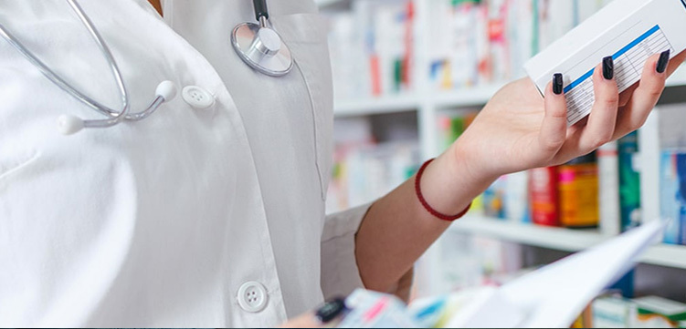 Pharmacist preparing medications in pharmacy
