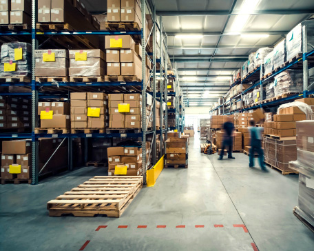 Industrial warehouse with shelving and goods